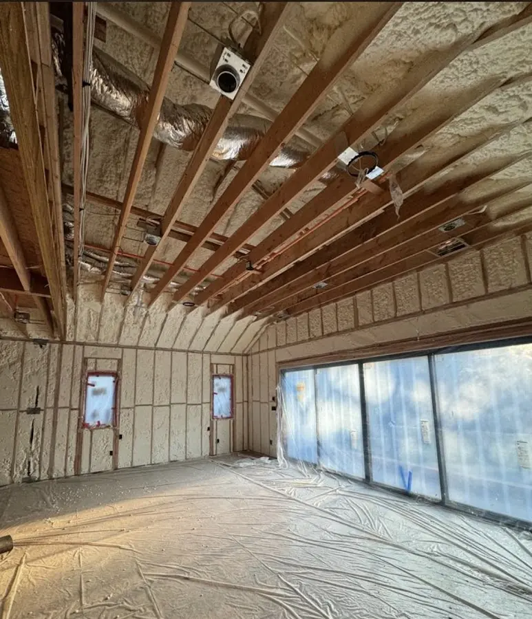 Interior walls and ceiling insulated with spray foam during new construction in Lakeland Village